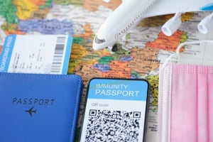 covid-vaccine-passport-qr-code-smartphone-screen-airplane-with-tickets-digital-768x512